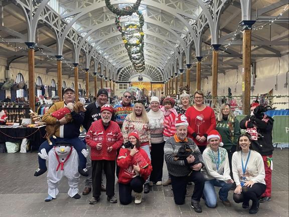 Group of traders at the market in festive outfits