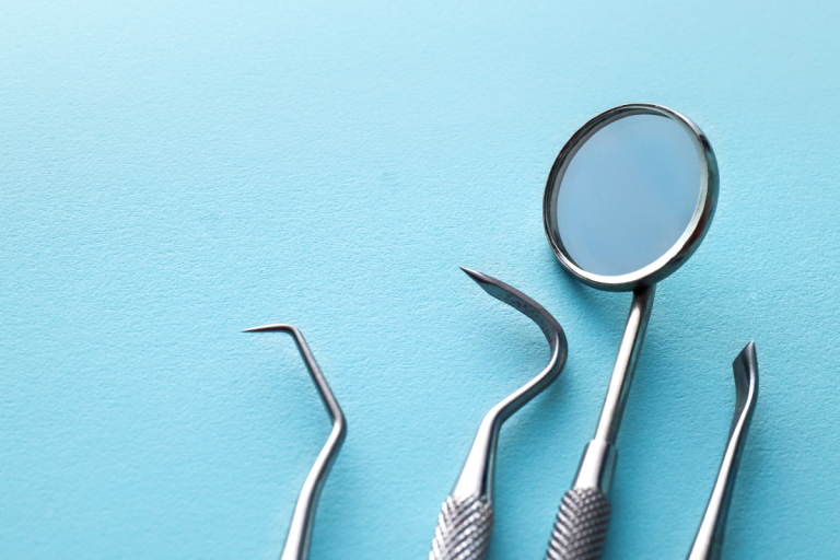 Dental tools on a blue background