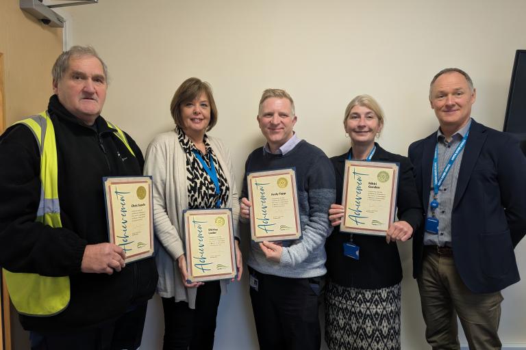 NDC employees with their long service awards