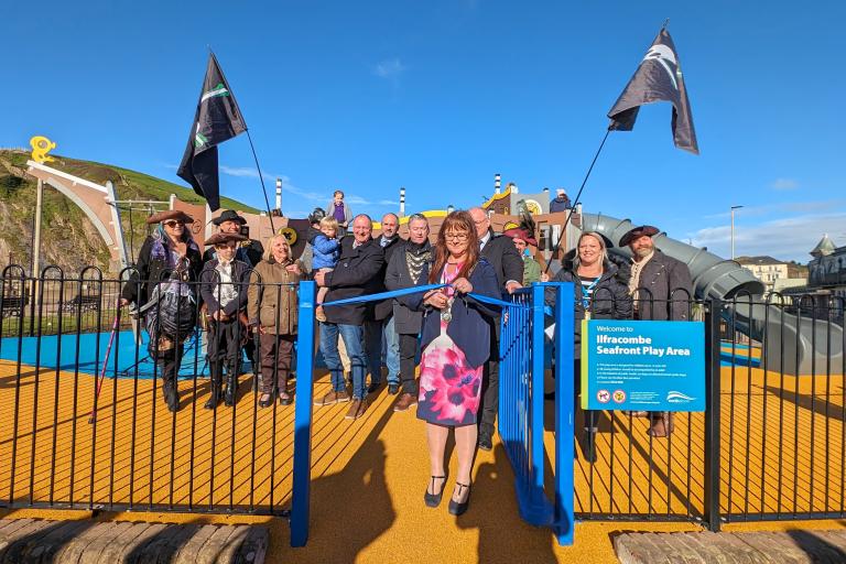 Cllr Julie Hunt cuts the ribbon on the new play area on Ilfracombe seafront